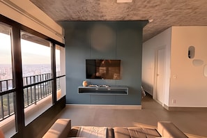 Comfort Apartment | Living area | 40-inch Smart TV with digital channels, pay movies