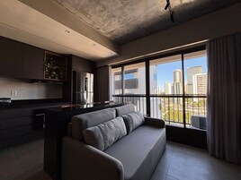 Luxury Apartment | Living area | 40-inch Smart TV with digital channels, pay movies