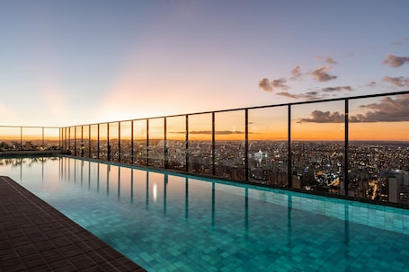 2 outdoor pools, open 8:00 AM to 11:00 PM, pool umbrellas, sun loungers