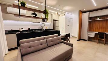 Luxury Apartment | Living area | 40-inch Smart TV with digital channels, pay movies