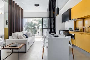 Comfort Apartment | Living area | 40-inch Smart TV with digital channels, pay movies