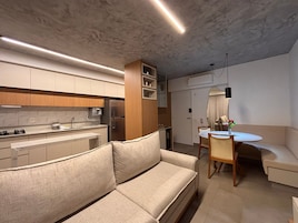 Grand Apartment | Living area | 40-inch Smart TV with digital channels, pay movies