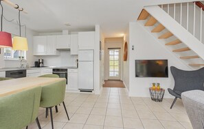 Fridge, stovetop, dishwasher, coffee/tea maker