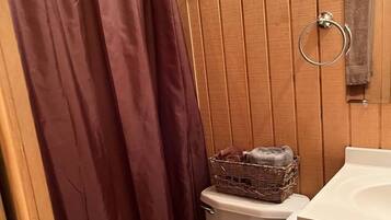 Shower, towels, soap, toilet paper