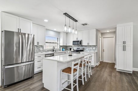 Fridge, microwave, oven, stovetop. Coastal Family Retreat – Heated Pool, Fire Pit & Fun!