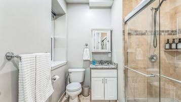 Shower, hair dryer, towels, soap