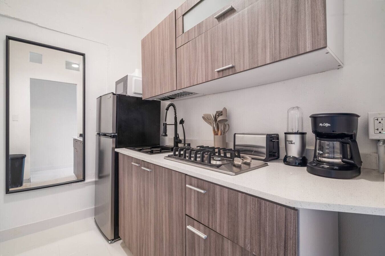 Fridge, microwave, stovetop, coffee/tea maker