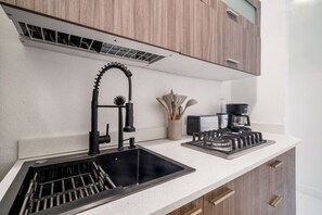 Fridge, microwave, stovetop, coffee/tea maker