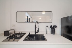 Fridge, microwave, stovetop, coffee/tea maker