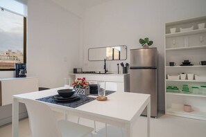 Fridge, microwave, stovetop, coffee/tea maker