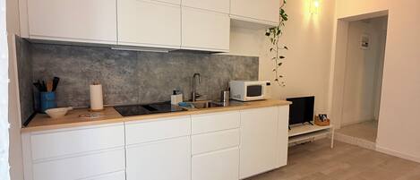 Fridge, microwave, stovetop, coffee/tea maker