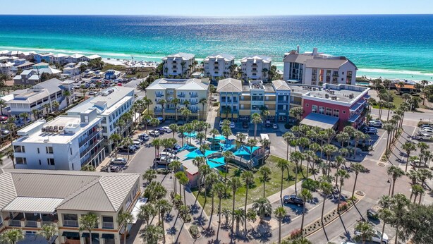 A coastal hotel with multiple buildings, a parking area, and a pool complex. - Gulf Place 210- Steps To Beach *Snowbirds Welcome* Large Balcony (Santa Rosa Beach)