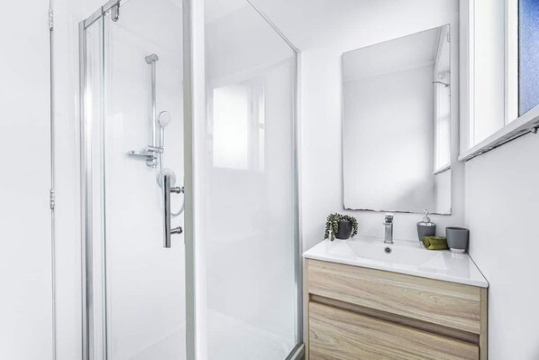 Shower, hair dryer, towels, soap