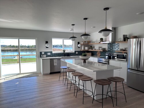 Brand new Modern, 6 bedroom waterfront home on a beautiful Long Lake.