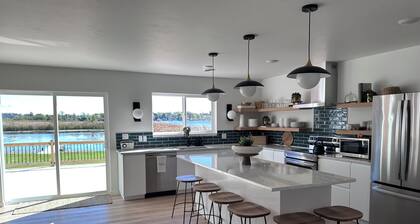 Brand new Modern, 6 bedroom waterfront home on a beautiful Long Lake.