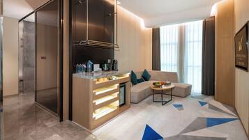 Romantic Suite | Living area | 60-cm LCD TV with cable channels