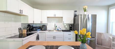 Fridge, microwave, stovetop, coffee/tea maker