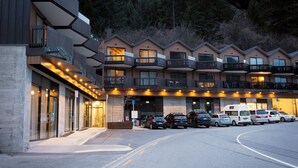 A multi-story hotel with balconies, a parking lot, and a building entrance. - Central Lofts 4 & 5 - Accessible - Brand New! (Queenstown)