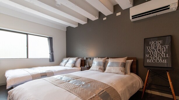 A hotel room with two beds, a large window, and a motivational poster. - 2min walk from Nakano Station 1min walk to Nakano Broadway MAX4 Guests(2) (中野区中野)
