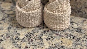 A pair of beige, textured baby shoes on a granite countertop. - 2-bedroom apt in Marina del Rey with pool, jacuzzi, gym, free parking! (Marina del Rey)