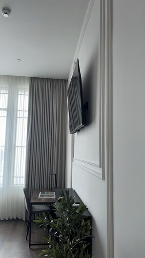 Desk, laptop workspace, blackout drapes, iron/ironing board