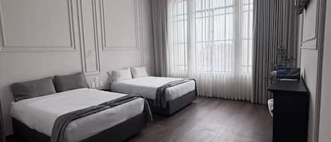 Desk, laptop workspace, blackout drapes, iron/ironing board