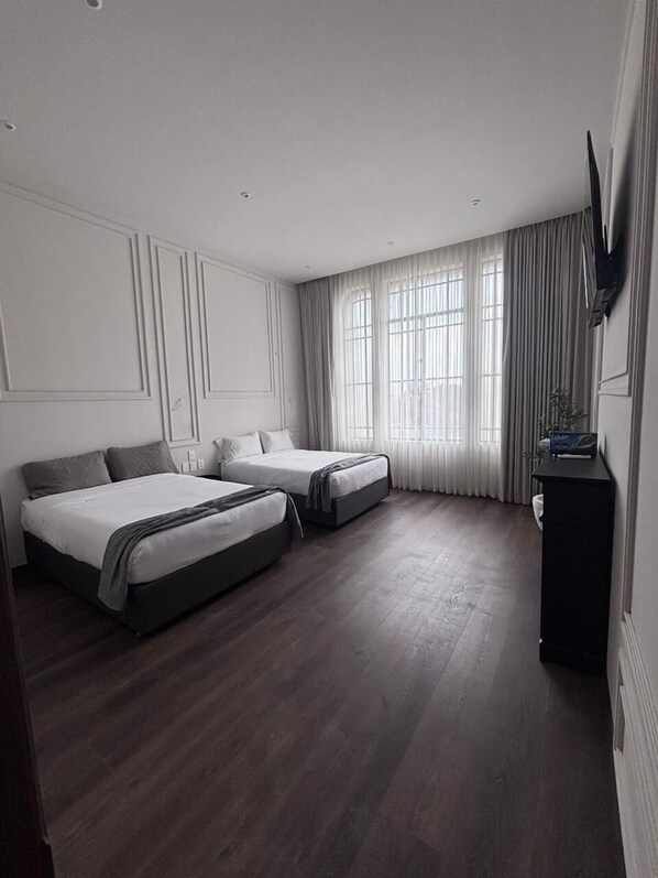 Desk, laptop workspace, blackout curtains, iron/ironing board