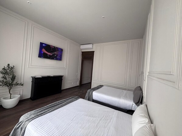 Desk, laptop workspace, blackout drapes, iron/ironing board