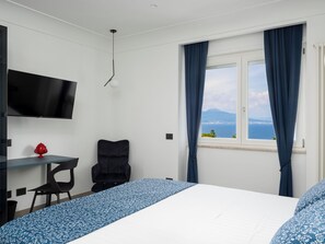 Luxury Apartment, Sea View | Desk, laptop workspace, blackout drapes, iron/ironing board