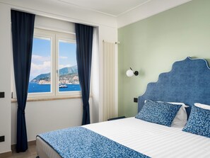 Luxury Apartment, Sea View | Desk, laptop workspace, blackout drapes, iron/ironing board