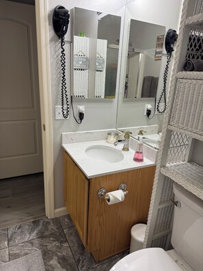 Shower, hair dryer, towels, soap