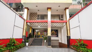 A building entrance with a staircase leading to a second floor. - Collection O District Tan Phu - Tien Thang Hotel  (Ho Chi Minh City)