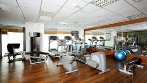 A gym with treadmills, elliptical machines, and weight equipment. - Lancaster Ho Chi Minh Serviced Apartment Official (Ho Chi Minh City)