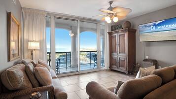 Signature Condo, 2 Bedrooms, Balcony, Beach View | Living room | 50-inch Smart TV with cable channels