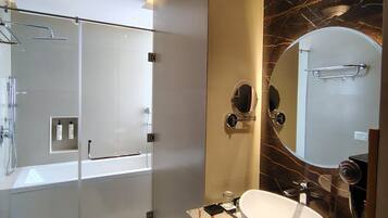 Deluxe Single Room, Pool View | Bathroom | Separate tub and shower, hair dryer, towels, soap