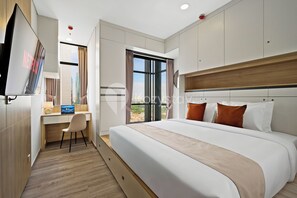 Apartment, 1 Bedroom, City View | Desk, laptop workspace, iron/ironing board, free WiFi