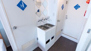 A small, narrow bathroom with a sink, two mirrors, and a toilet. - 2min walk from Nakano Station 1min walk to Nakano Broadway MAX6 Guests(4) (中野区中野)