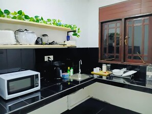 Microwave, coffee/tea maker, toaster, cookware/dishes/utensils