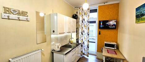 Fridge, microwave, stovetop, coffee/tea maker