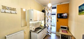 Fridge, microwave, stovetop, coffee/tea maker