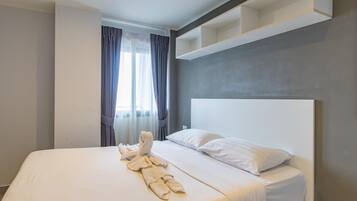 Appartement, 1 chambre, balcon | Coffres-forts dans les chambres, rideaux occultants