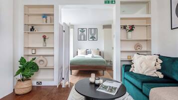 1 bedroom, desk, iron/ironing board, travel crib