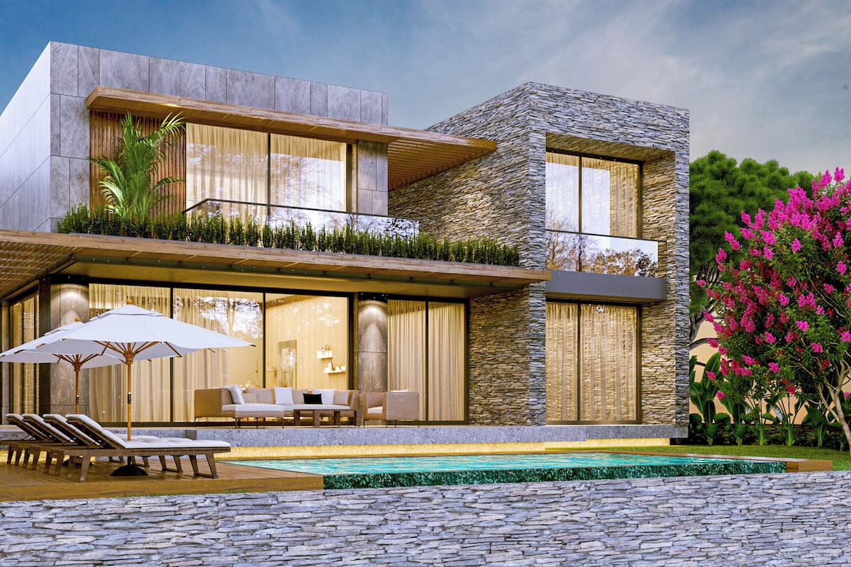 A modern two-story house with a pool, outdoor seating, and a stone facade.