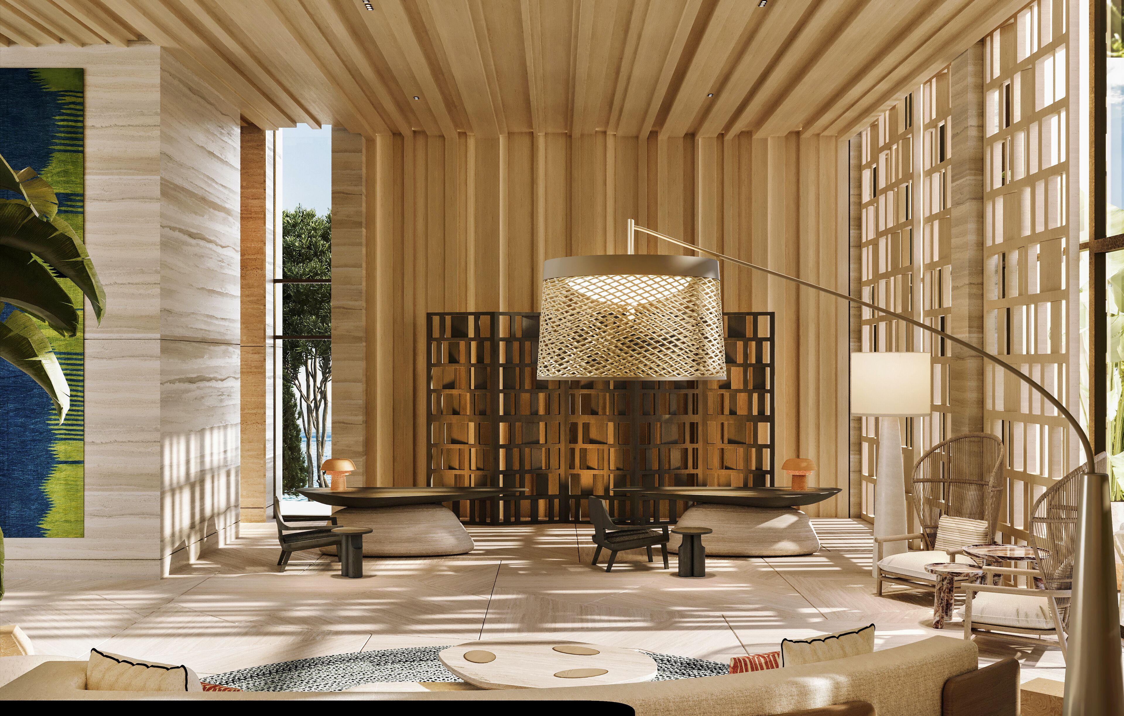 A spacious room with a large window, a central table, and seating arrangements.