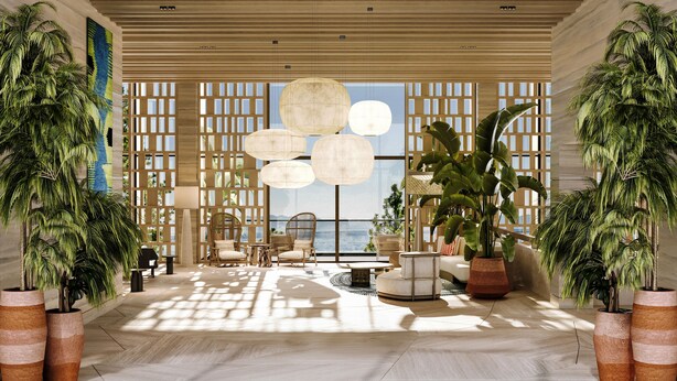 Un hall d’entrée spacieux, doté de grandes fenêtres, d’un lustre moderne et de plusieurs plantes en pot.