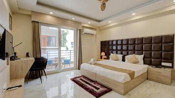 Superior Apartment, Balcony, City View | Desk, laptop workspace, iron/ironing board, bed sheets