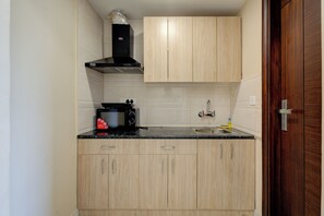 Superior Apartment, Balcony, City View | Private kitchenette | Fridge, microwave - The Paras Studio Serviced Apartments (Gurugram)