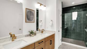 Shower, hair dryer, towels, shampoo