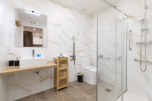 Shower, towels, shampoo, toilet paper