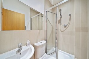 Shower, towels, soap, toilet paper
